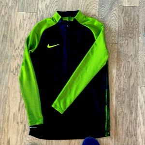 Nike Aeroswift 3/4 zip. Black with neon sleeves. It has been worn once or twice.